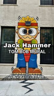 Think you’ve seen all of NYC’s street art? Think again. 🎨💡Tom Bob’s “Jack Hammer Head Lamp” is one of those delightful surprises that makes exploring New York City so much fun. By transforming an ordinary light fixture into part of the artwork, he turns an everyday streetscape into something playful, creative, and completely unexpected. ❤️🤩📍Find it at the southwest corner of East 12th Street & Avenue C in the East Village.It’s a quick stop that’s guaranteed to make you smile, and a perfect reminder that some of New York’s most memorable discoveries are hiding in plain sight.Looking for an extra fun way to tour NYC? Get in touch!!#JustAskChristine #TomBob #NYCStreetArt #EastVillage #ExploreNYC